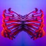 Symmetrical mirrored mushrooms glowing in vibrant red and purple neon light, creating a psychedelic butterfly shape